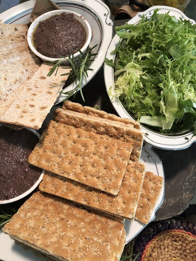 A traditional Middle Eastern meal with flatbread and fresh greens.