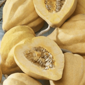 Close-up of halved and whole melons with seeds visible.